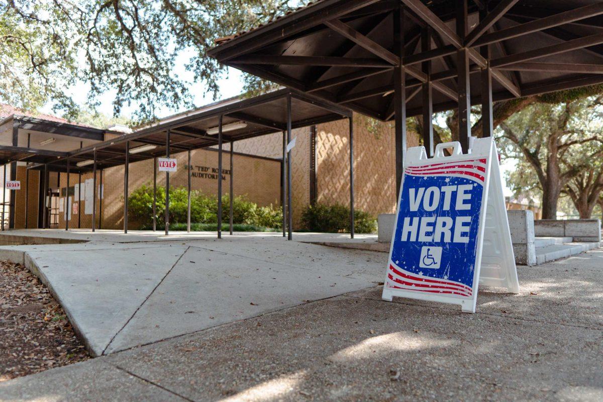 A sign reads &#8220;Vote Here&#8221; on Tuesday, Nov. 8, 2022, outside of the LSU Laboratory School on East Campus Drive in Baton Rouge, La.