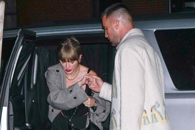 Travis Kelce helps Taylor Swift out of a car in New York City on Oct. 15.