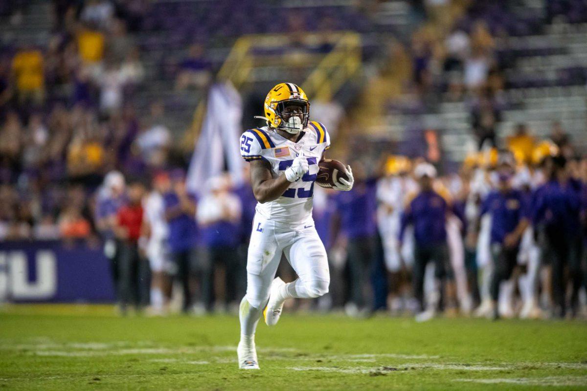 LSU football freshman running back Trey Holly (25) runs the ball to the end zone on Saturday, Oct. 21, 2023, during LSU's 62-0 win against Army at Tiger Stadium in Baton Rouge, La.