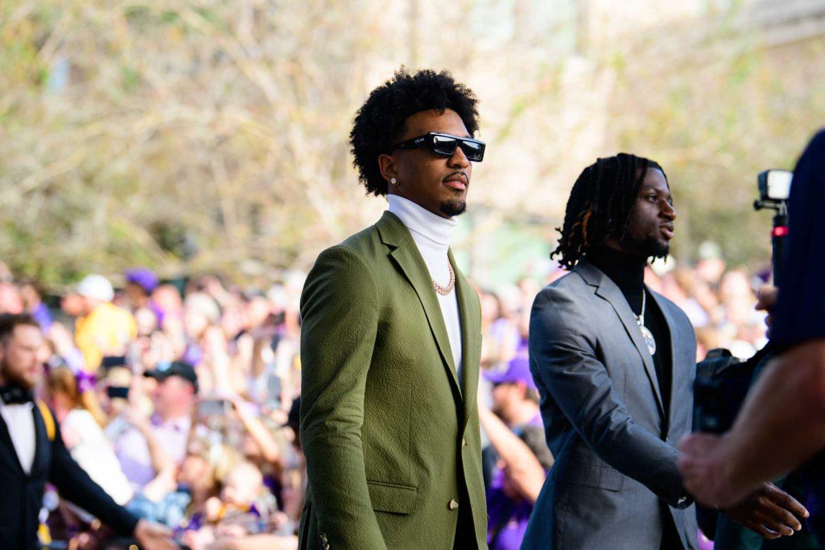 LSU football senior quarterback Jayden Daniels (5) walks down Victory Hill on Saturday, Oct. 21, 2023, before LSU's 62-0 victory against Army in Tiger Stadium in Baton Rouge, La.