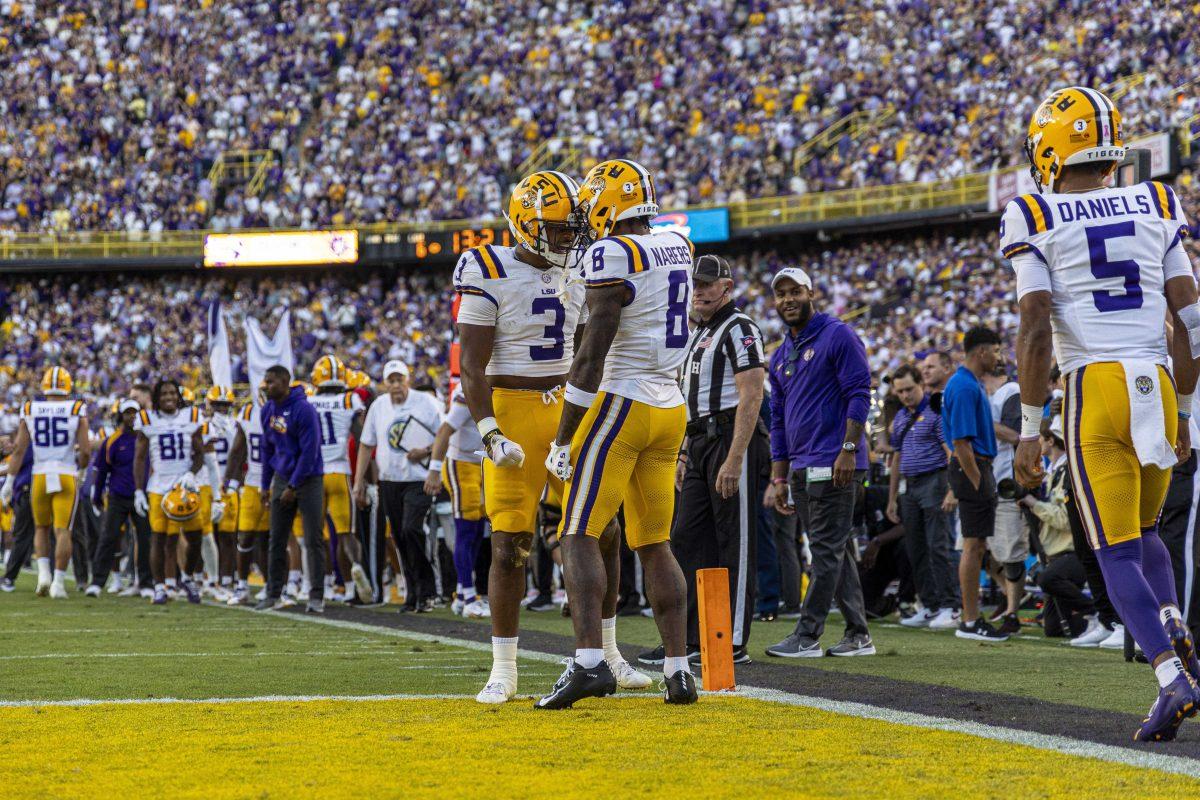 LSU football junior wide receiver Malik Nabors (8) celebrates his touchdown with junior running back Logan Diggs (3) Saturday, Oct. 14, 2023, during LSU&#8217;s 48-18 win against Auburn in Tiger Stadium in Baton Rouge, La.