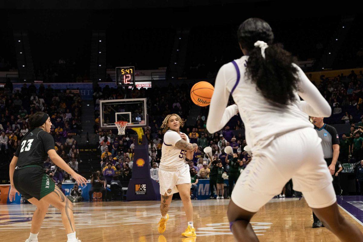 LSU women&#8217;s basketball sophomore guard Kateri Poole (55) passes the ball to freshman guard Flau&#8217;jae Johnson (4) Friday, March 17, 2023, during LSU&#8217;s 73-50 win against Hawaii at the Pete Maravich Assembly Center in Baton Rouge, La.