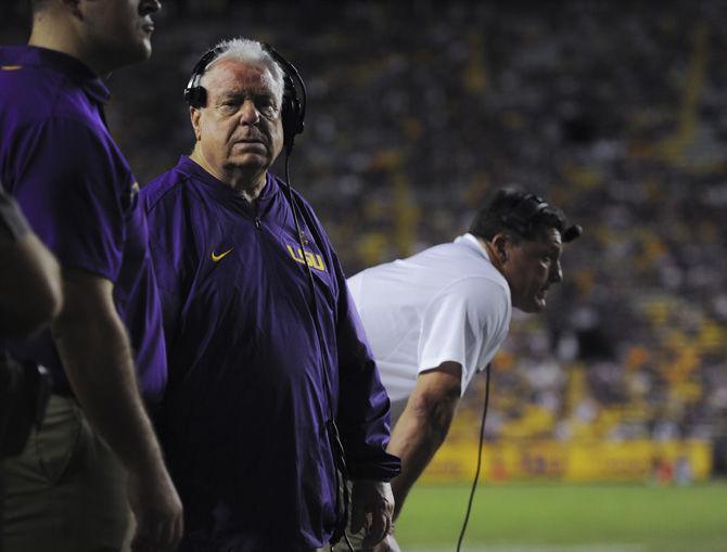 LSU defensive line coach Pete Jenkins stands alongside interim head coach Ed Orgeron near the sidelines on Saturday, Oct. 15, 2016, during the Tigers' 45-10 victory against the Golden Eagles in Tiger Stadium.