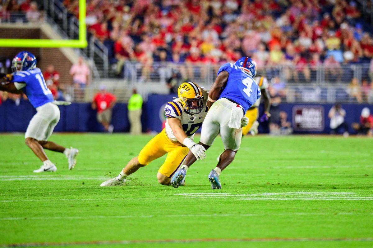 LSU football freshman linebacker Whit Weeks (40) tackles his opponent on Saturday, Sept. 30, 2023, during LSU's 55-49 loss against Ole Miss in Vaught-Hemingway Stadium in Oxford, Miss.