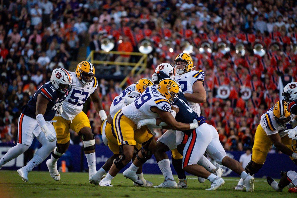 LSU football players engage with Auburn during the 48-18 LSU win vs. Auburn on Saturday, Oct. 14, 2023, at Tiger Stadium in Baton Rouge, La.