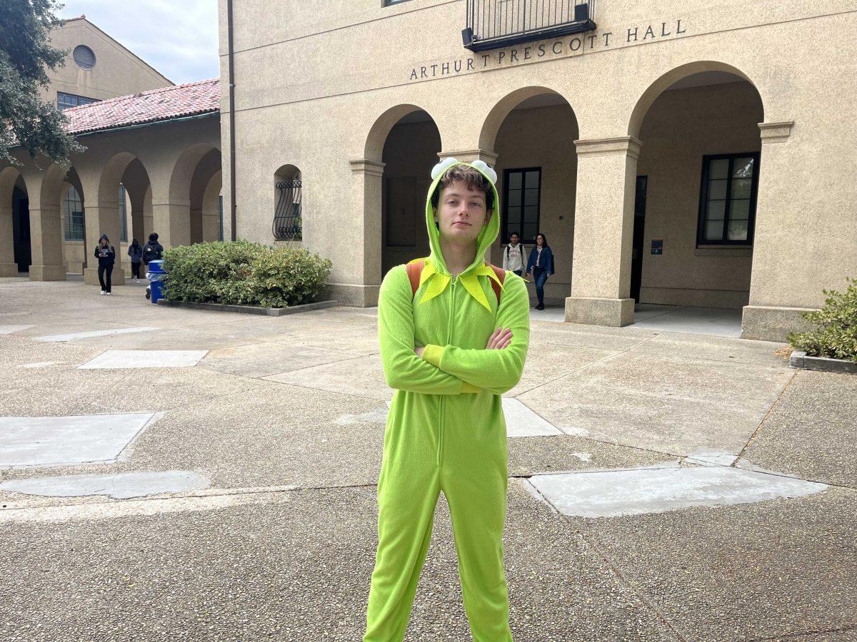 Math freshman Ian Frick stands in the Quad wearing a Kermit the Frog costume on Oct. 31, 2023 in Baton Rouge, La.