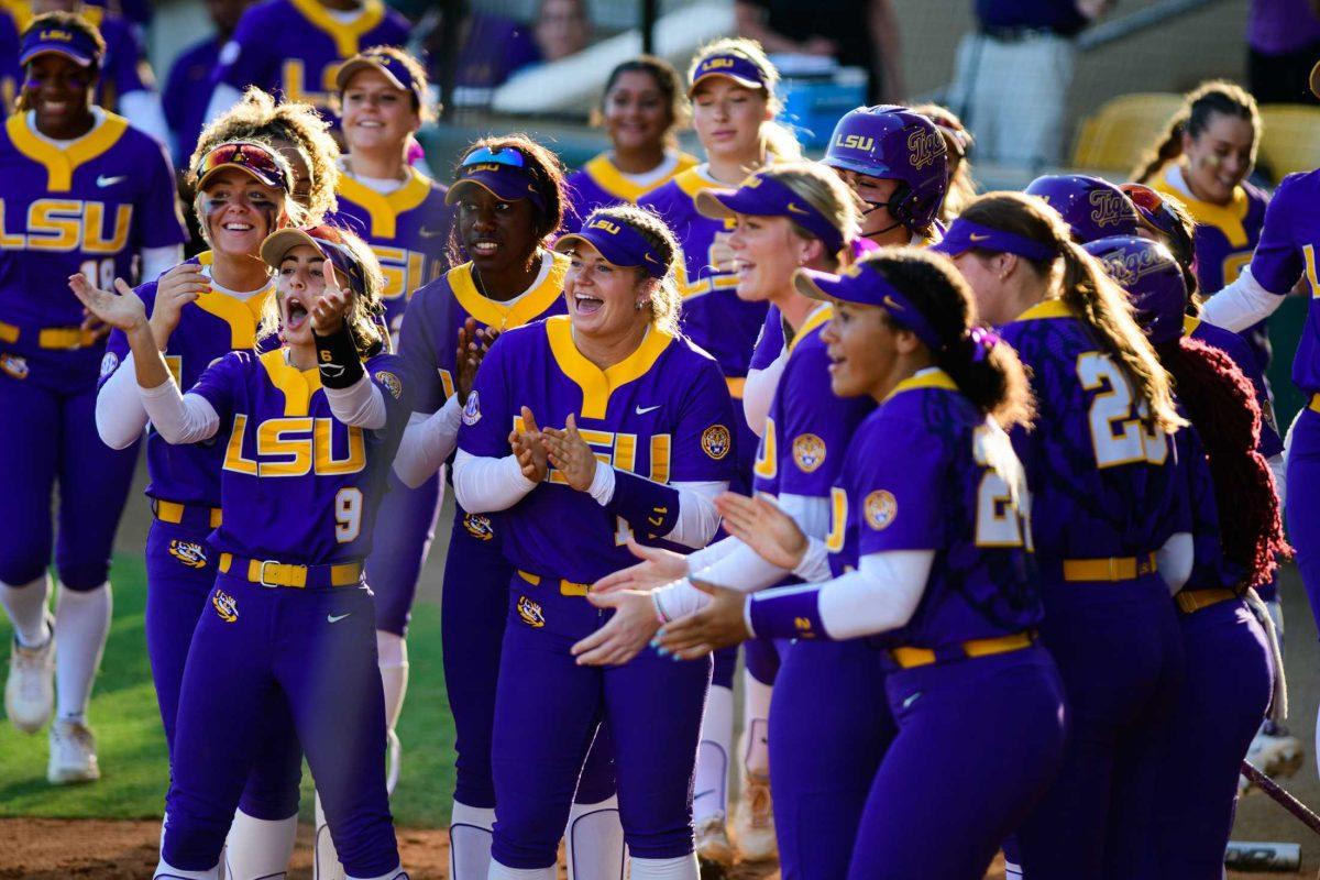 The LSU softball team celebrates a home run on Friday, Oct. 20, 2023, during LSU's exhibition game against Co-Lin CC in Tiger Park in Baton Rouge, La.