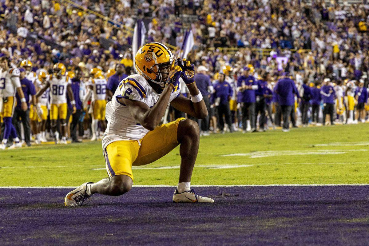 LSU football senior wide receiver Kyren Lacy (2) takes imaginary pictures of his teammates celebrating a touchdown Saturday, Oct. 14, 2023, during LSU&#8217;s 48-18 win against Auburn in Tiger Stadium in Baton Rouge, La.