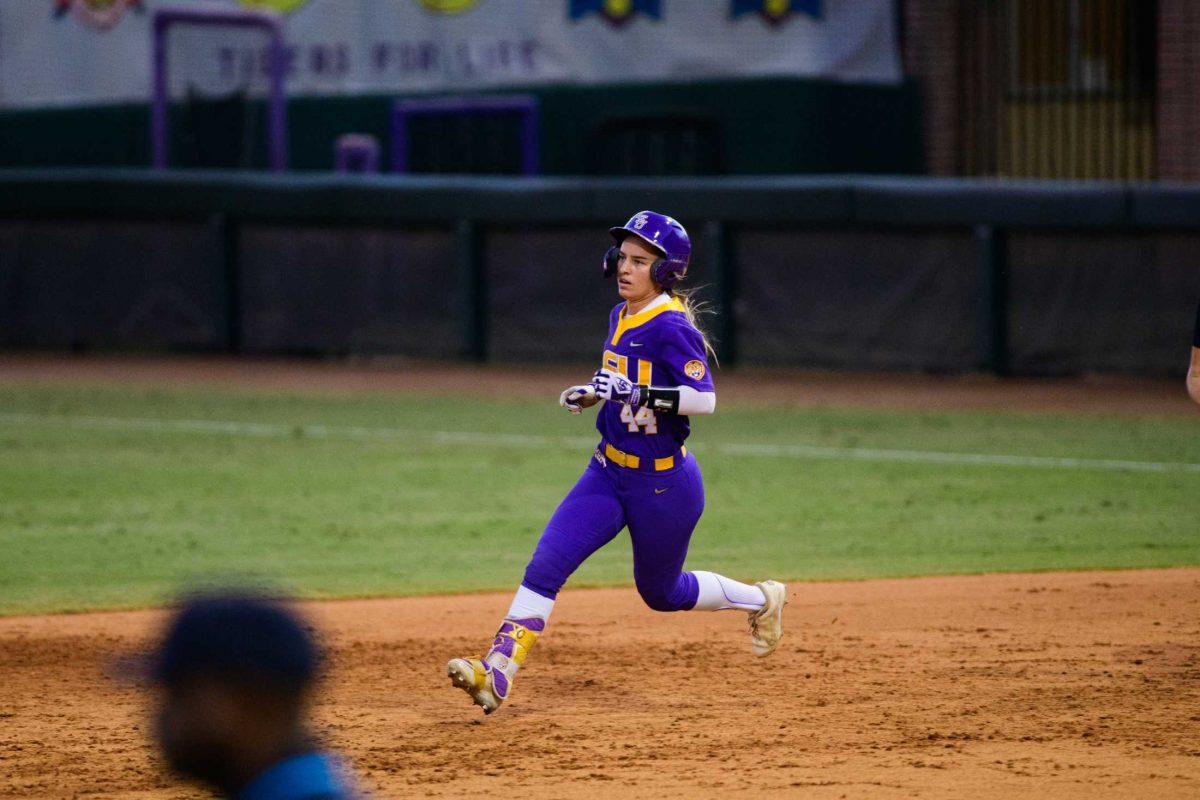 LSU softball senior outfield/catcher Ali Newland (44) sprints between bases on Friday, Oct. 20, 2023, during LSU's exhibition game against Co-Lin CC in Tiger Park in Baton Rouge, La.