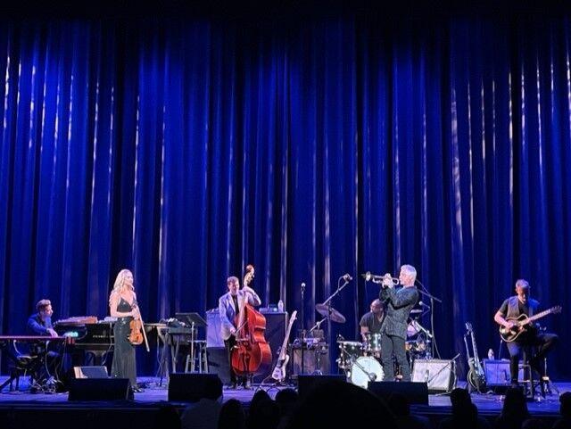 Chris Botti performs alongside his band members in the Raising Cane's River Center.