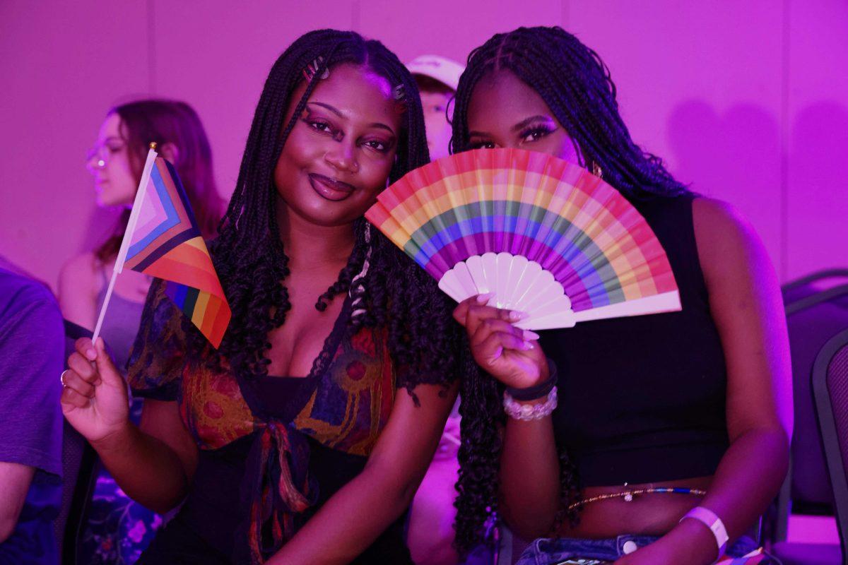 Two students attend the Geaux Diva Live Drag Show in the Royal Cotillion Ballroom. Photo by Ricky Bryant.