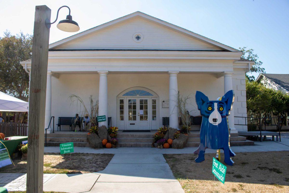 A blue dog statue sits out front of the Sugar Fest entrance on Sunday, Oct. 1, 2023, at the West Baton Rouge Museum in Port Allen, La.