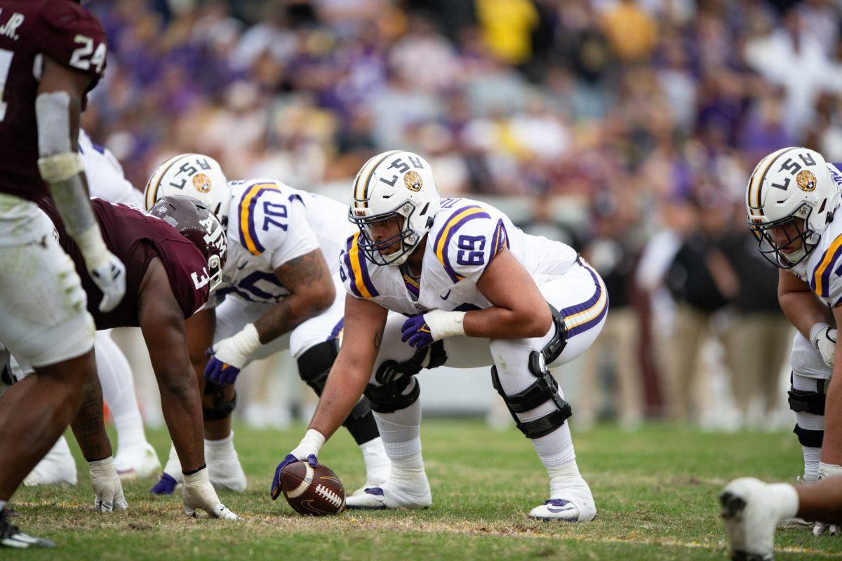 LSU football 5th-year senior offensive line Charles Turner III (69) prepares to hike the ball Saturday, Nov. 25, 2023, during LSU's 42-30 win against Texas A&amp;M at Tiger Stadium in Baton Rouge, La.