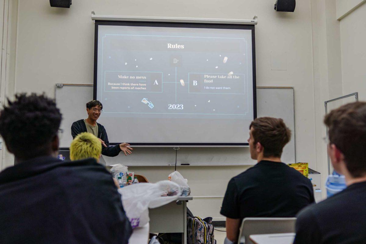 LSU digital advertising junior Calvin Trinh explains the rules for movie night at the Furry Club meeting Thursday, Nov. 9, 2023, inside Coates Hall on LSU's campus.