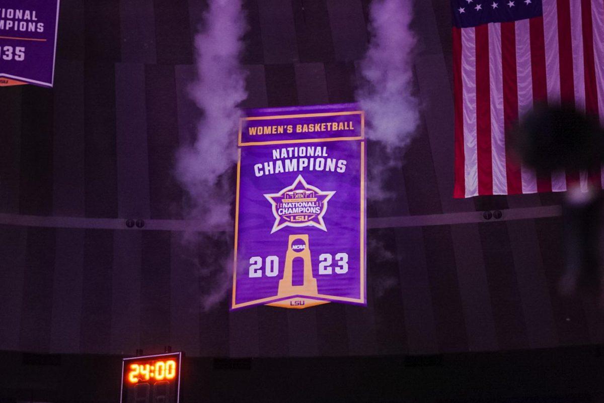 The LSU National Champions banner rises into the rafters Thursday, Nov. 9, 2023, inside the Pete Maravich Assembly Center in Baton Rouge, La.