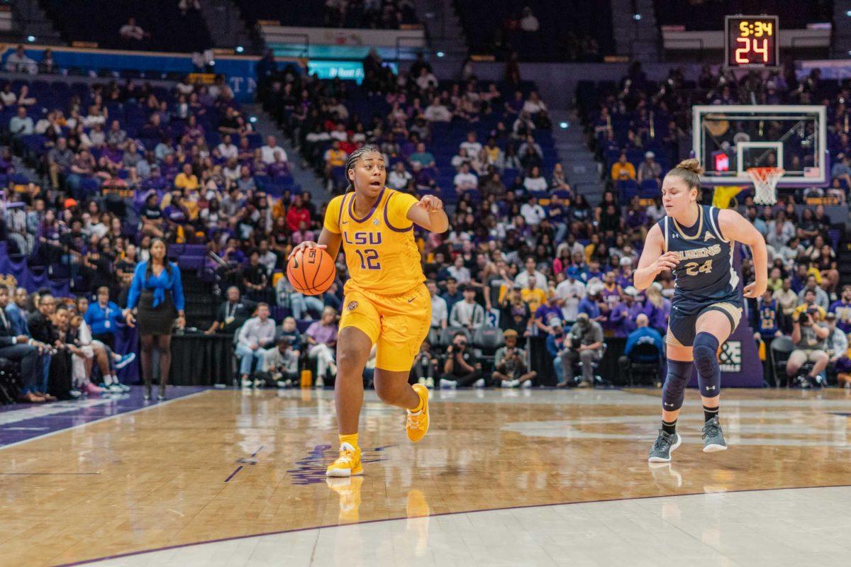 LSU women&#8217;s basketball freshman guard Mikaylah Williams (12) directs the play Thursday, Nov. 9, 2023, during LSU&#8217;s 112-55 win over Queens in the Pete Maravich Assembly Center in Baton Rouge, La.