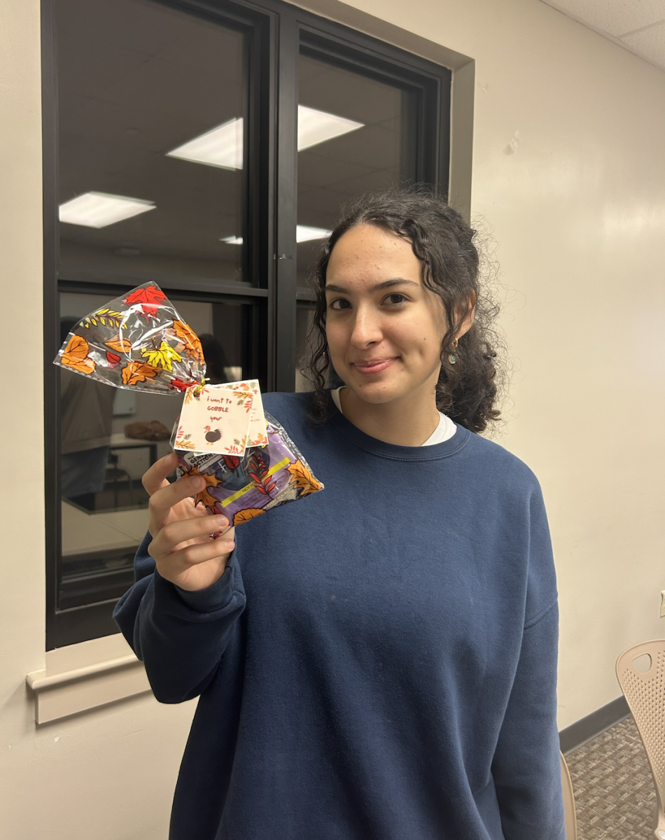 Perim Isim, Feminists in Action&#8217;s treasurer and head of the Fundraising and Philanthropy Committee, holds a Thanksgiving-themed condom-gram on Thursday, Nov. 9 in Baton Rouge, La.&#160;