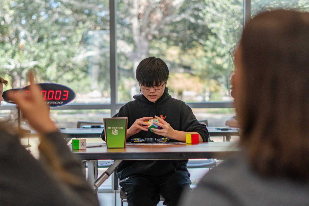 Siwoo Kim competes in megaminx Saturday, Nov. 25, 2023, during Fleur-de-Lis Fall at the Main Library in Baton Rouge, La.