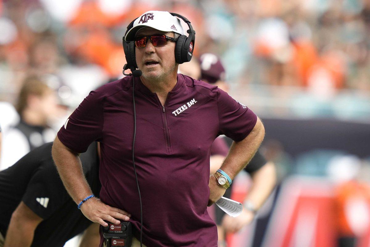 Texas A&amp;M head coach Jimbo Fisher watches during the first half of an NCAA college football game against Miami, Saturday, Sept. 9, 2023, in Miami Gardens, Fla. (AP Photo/Lynne Sladky)