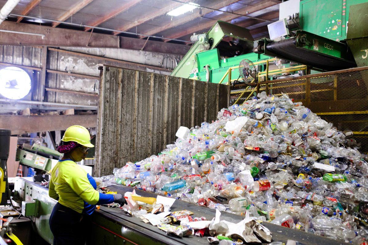 A line worker sorts recyclables from trash within the Republic Services Materials Recovery Facility in Baton Rouge, La. on Nov. 8.