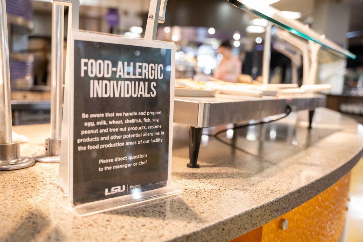 A food allergy sign sits in front of pizza Monday, Oct. 23, 2023 at the 5 dining hall on Dalrymple Drive in Baton Rouge, La.