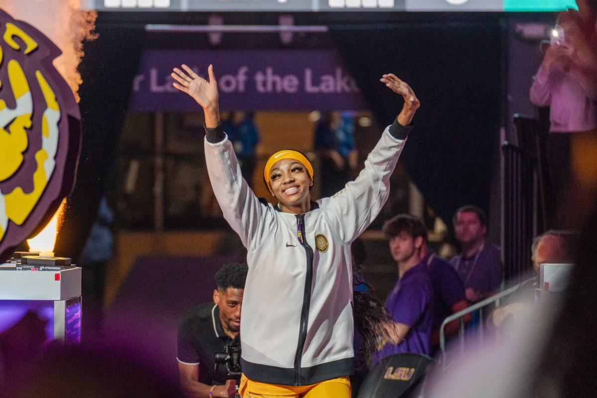 LSU women&#8217;s basketball junior forward Angel Reese (10) runs out onto the court Thursday, Nov. 9, 2023, during LSU&#8217;s 112-55 win over Queens in the Pete Maravich Assembly Center in Baton Rouge, La.