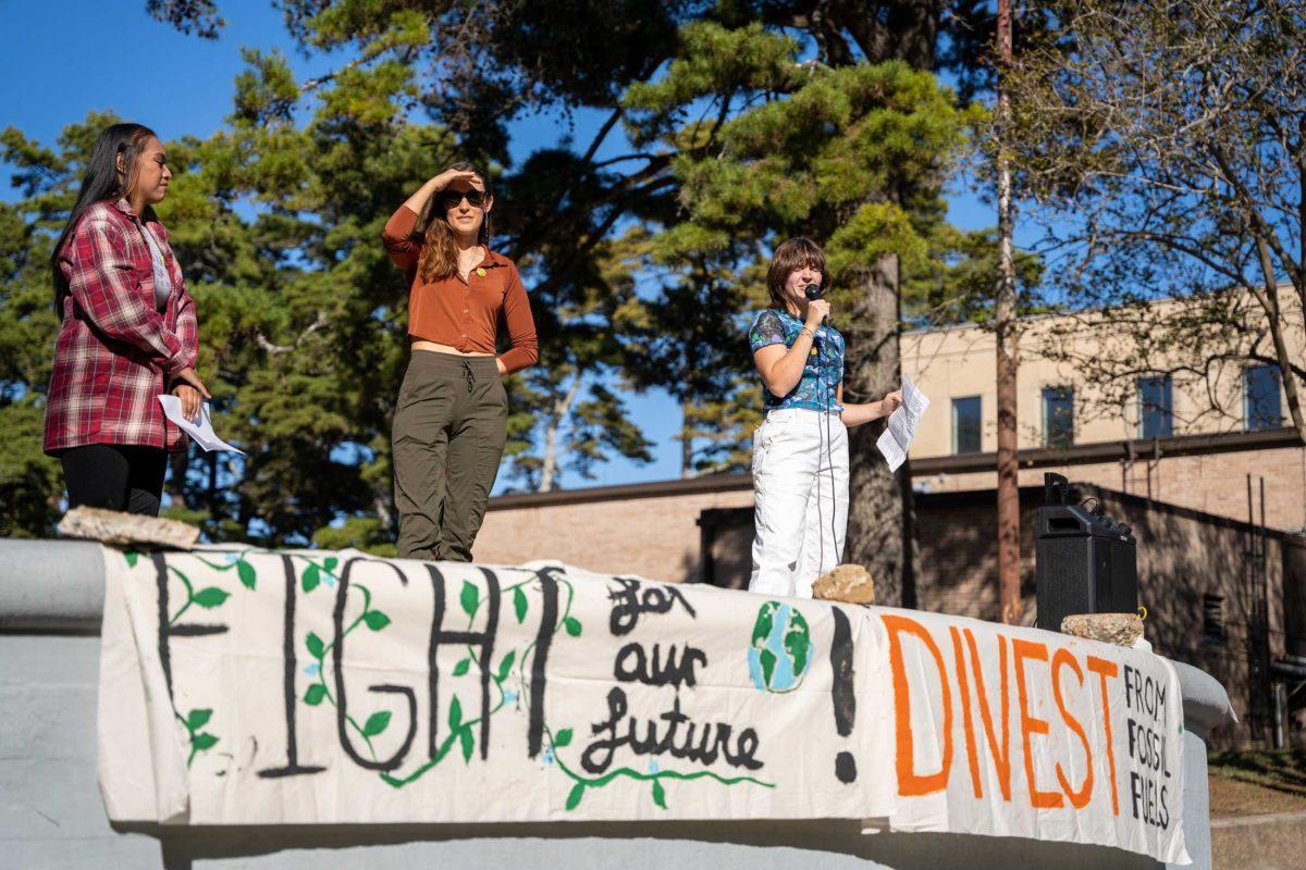 Climate Pelican and Geaux Planet members Corinne Salter, Jill Tupitza, and Cheyenne Autin discuss divesting Friday, Nov. 3, 2023, at the LSU Greek Theater in Baton Rouge, La.