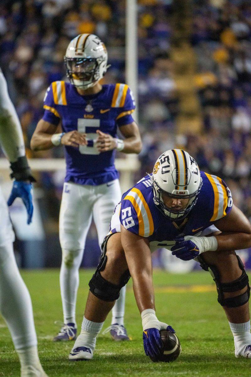 LSU football 5th-year senior offensive line Charles Turner III (69) prepares to snap the ball Saturday, Nov. 18, 2023, during LSU's 56-14 win against Georgia State in Tiger Stadium in Baton Rouge, La.