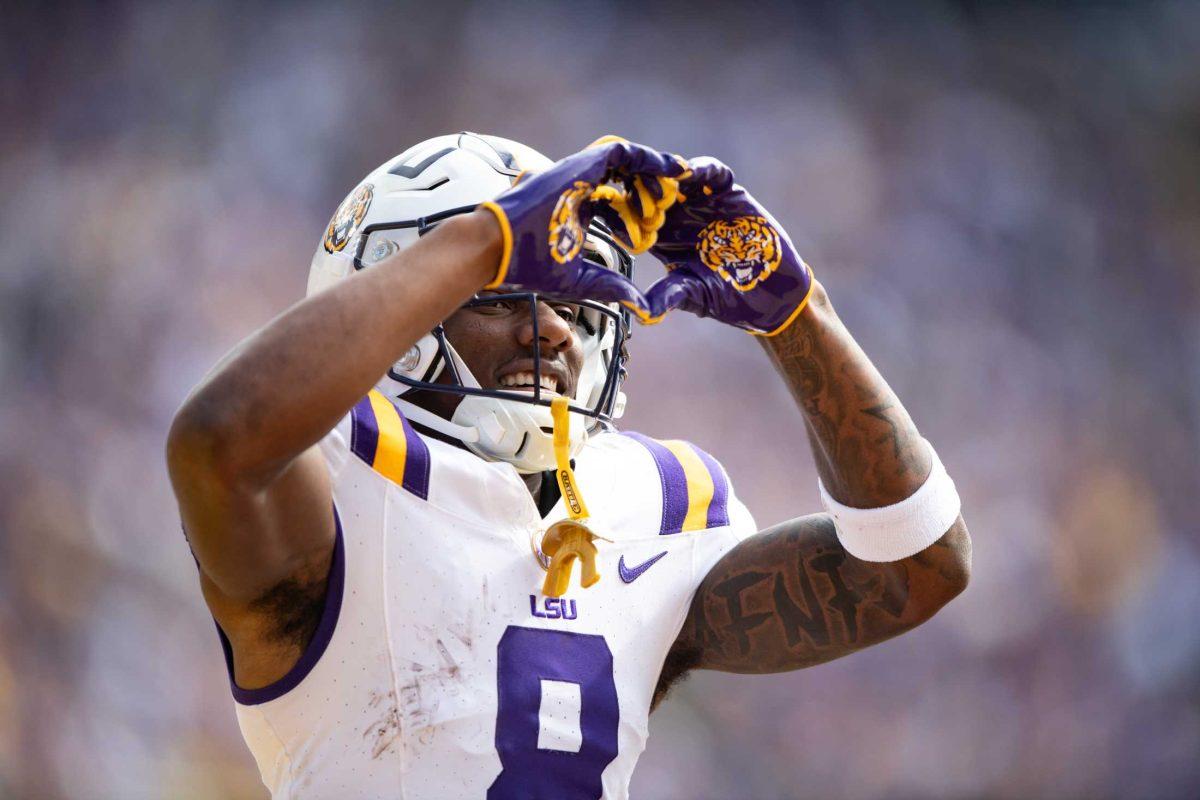 LSU football junior wide receiver Malik Nabers (8) holds his hands up in a heart Saturday, Nov. 25, 2023, during LSU's game against Texas A&amp;M at Tiger Stadium in Baton Rouge, La.