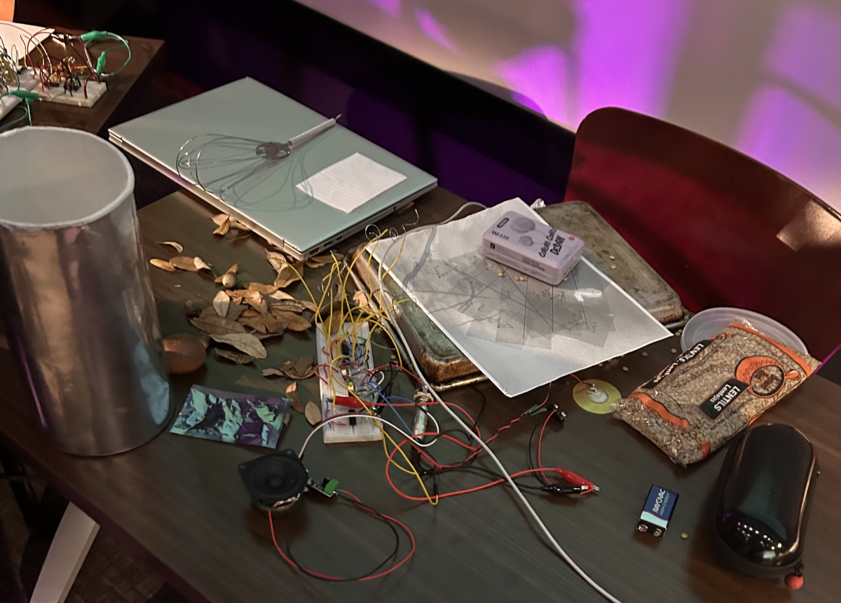 The table the Laptop Orchestra of Louisiana performed on was full of their trinkets and circuits, including a bag of rice, a whisk, leaves, and some pieces of paper. All were used during the concert on Wednesday, Nov. 1, 2023, at the LSU Digital Media Center in Baton Rouge, La.