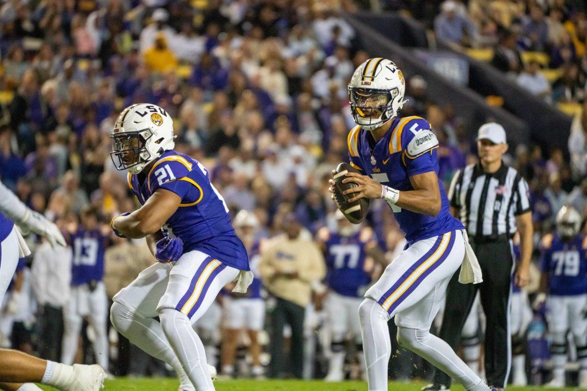 LSU football senior quarterback Jayden Daniels (5) prepares to throw the ball Saturday, Nov. 18, 2023, during LSU's 56-14 win against Georgia State in Tiger Stadium in Baton Rouge, La.