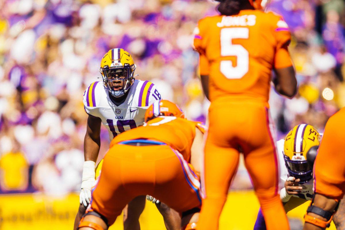 LSU football senior linebacker Damone Clark (18) focuses on the ball before a play Saturday, Oct. 16, 2021, during LSU's 49-42 win against Florida at Tiger Stadium in Baton Rouge, La.