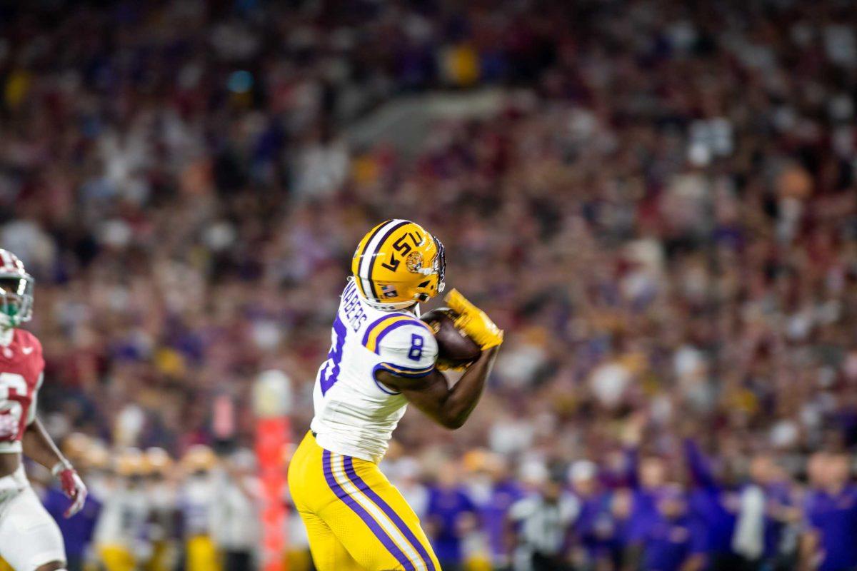 <p>LSU football junior wide receiver Malik Nabers (8) catches the ball resulting in a touchdown on Saturday, Nov. 4, 2023, during LSU's 42-28 loss against Alabama in Bryant-Denny stadium in Tuscaloosa, Al.</p>