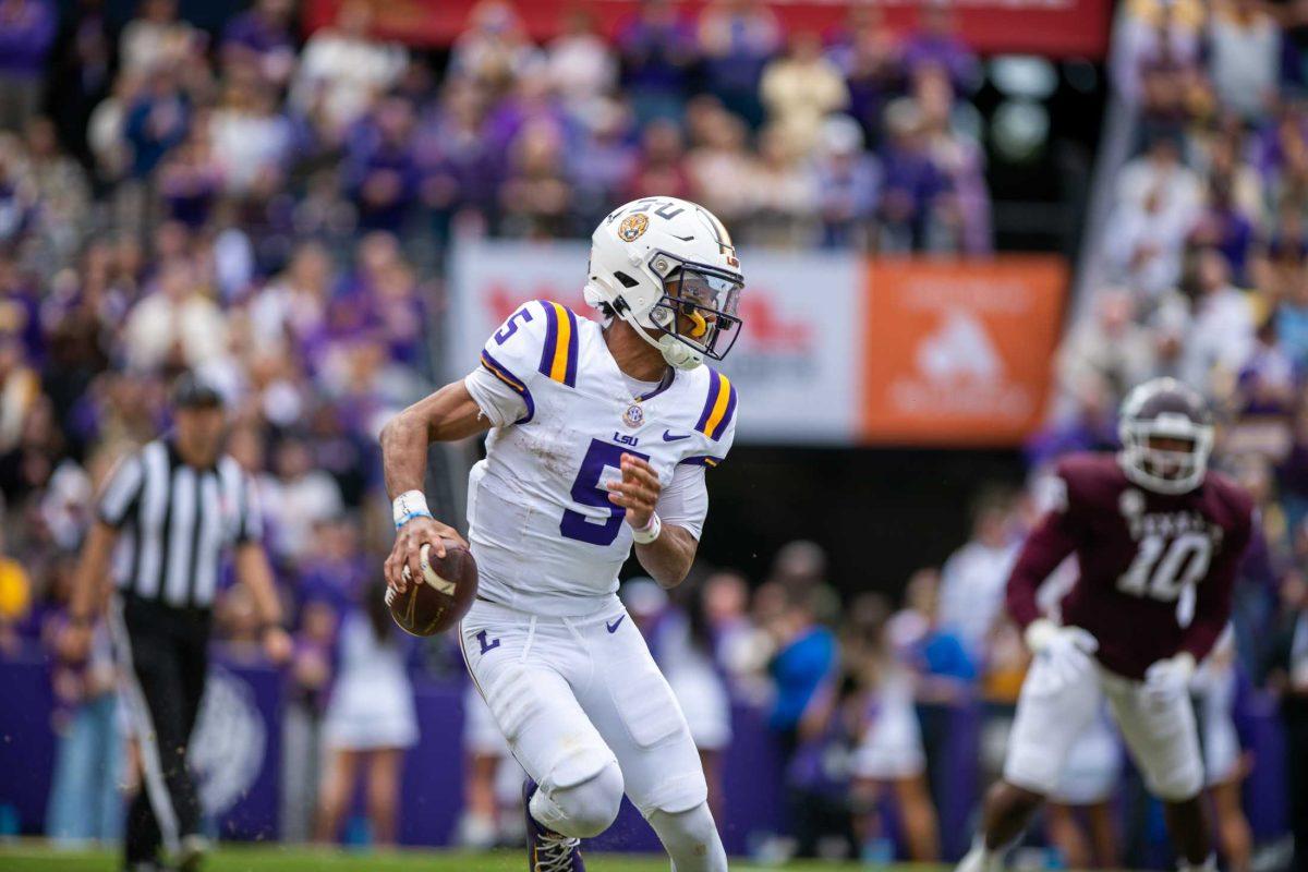 LSU football senior quarterback Jayden Daniels (5) navigates the field while running the ball during&#160;LSU's 42-30 win against Texas A&amp;M on Saturday, Nov. 25, 2023, at Tiger Stadium in Baton Rouge, La.