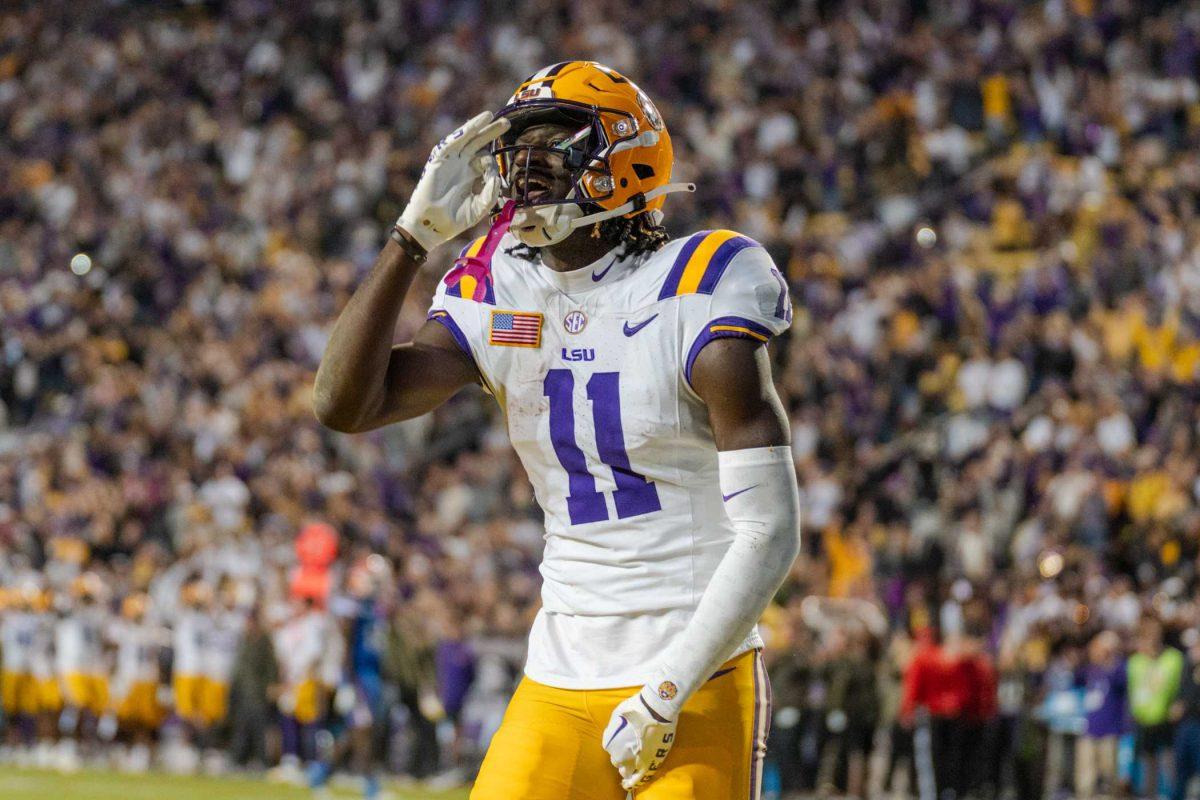 LSU football junior wide receiver Brian Thomas Jr. (11) celebrates after scoring Saturday, Nov. 11, 2023, during LSU&#8217;s 52-35 win against Florida in Tiger Stadium in Baton Rouge, La.