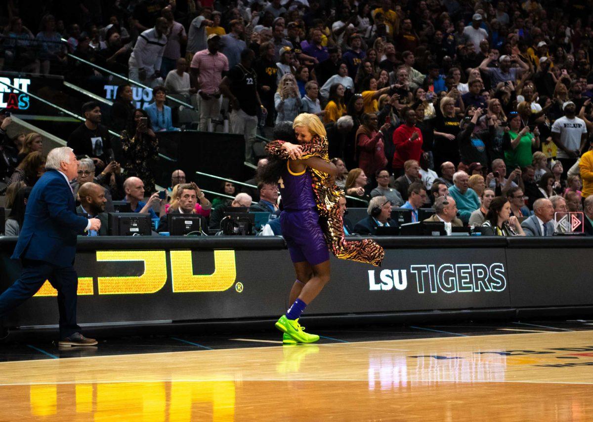 LSU women&#8217;s basketball freshman guard Flau&#8217;jae Johnson (4) embraces LSU women&#8217;s basketball head coach Kim Mulkey on Sunday, April 2, 2023, during LSU's 102-85 win against Iowa in the NCAA National Championship in the American Airlines Center in Dallas, Texas.