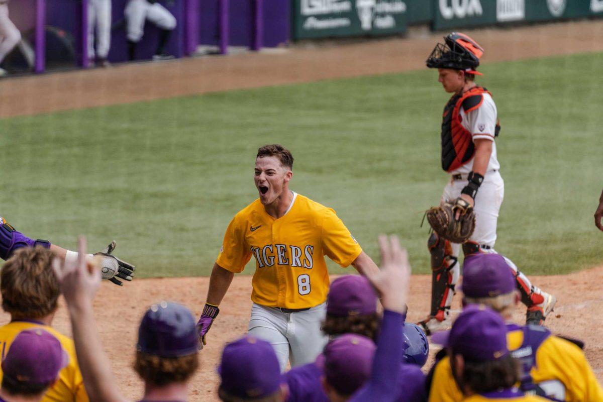 LSU baseball graduate student infielder Gavin Dugas (8) celebrates his home run Monday, June 5, 2023, during LSU&#8217;s 13-7 win against Oregon state in Alex Box Stadium in Baton Rouge, La.