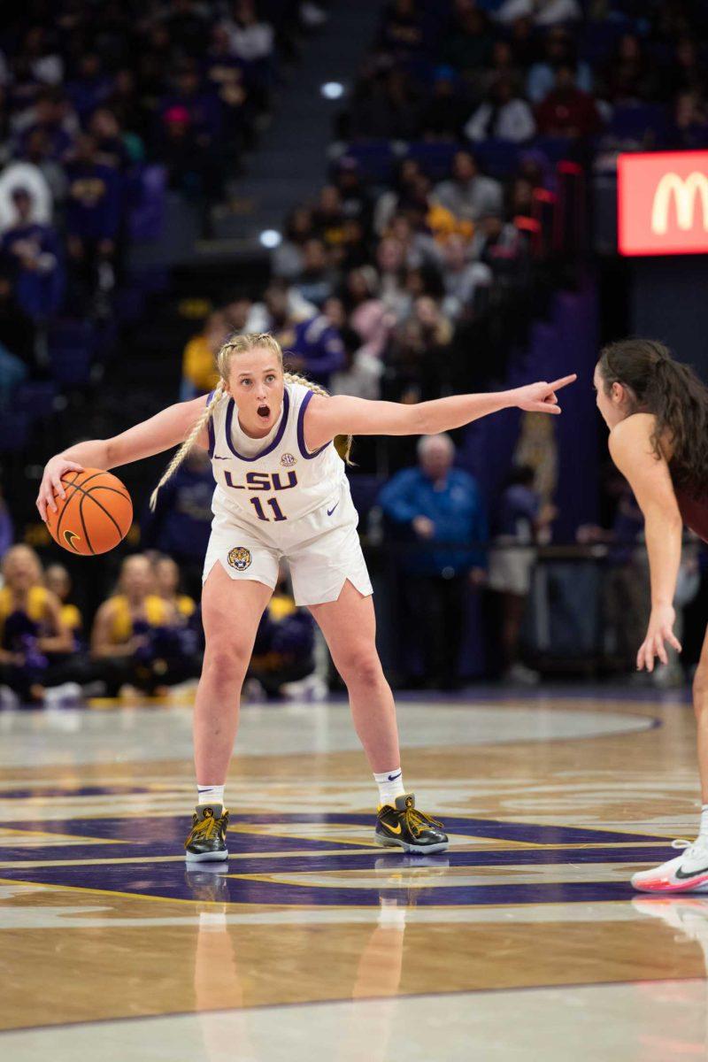 LSU women's basketball graduate student guard Hailey Van Lith (11) directs her teammates Thursday, Nov. 30, 2023, during LSU's 82-64 win against Virginia Tech at the Pete Maravich Assembly Center in Baton Rouge, La.