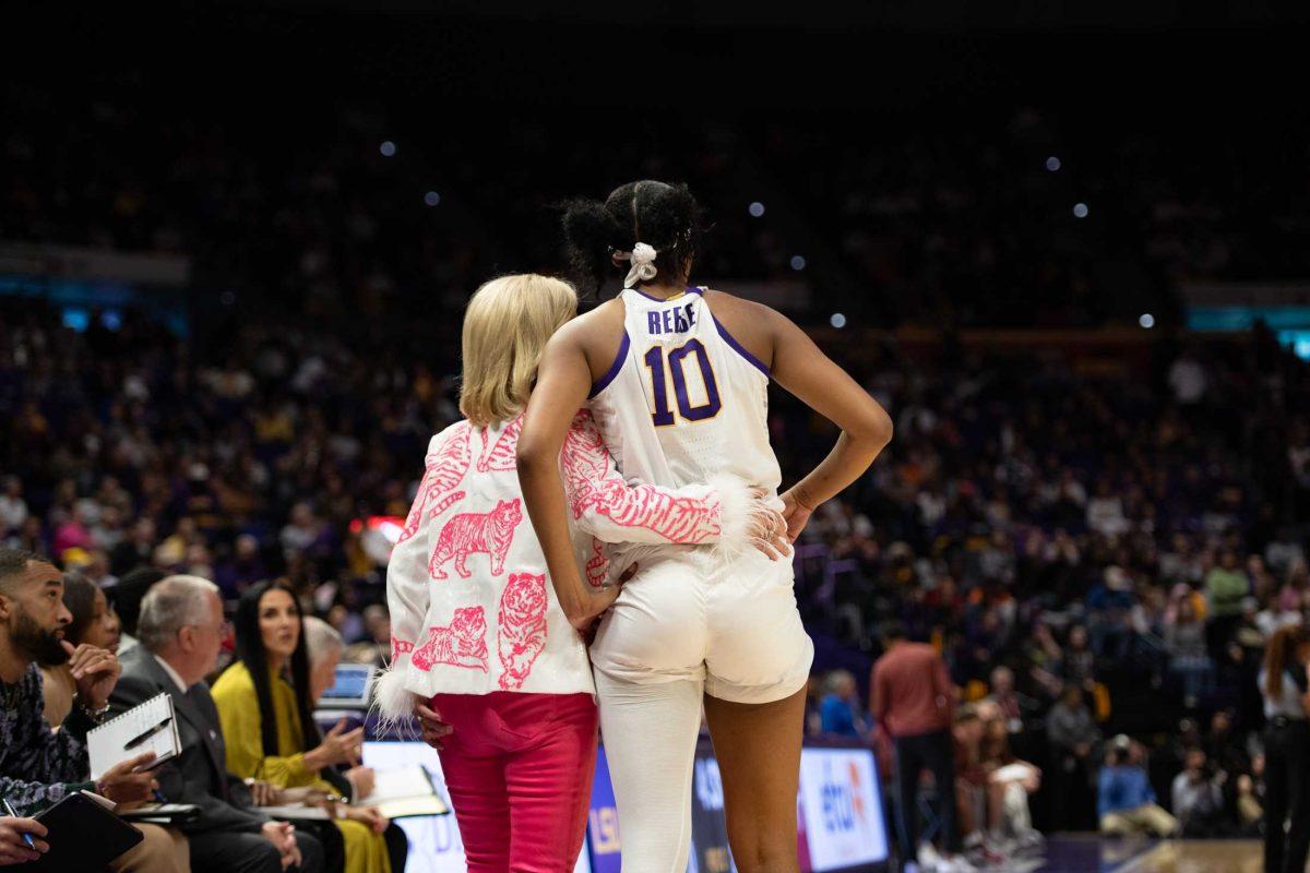 LSU women's basketball head coach Kim Mulkey wraps her arm around junior forward Angel Reese (10) Thursday, Nov. 30, 2023, during LSU's 82-64 win against Virginia Tech at the Pete Maravich Assembly Center in Baton Rouge, La.