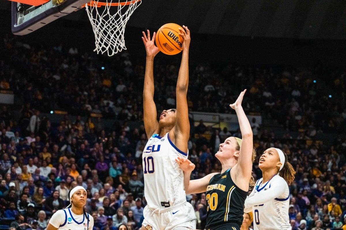 LSU women's basketball sophomore forward Angel Reese (10) makes a rebound during their 66-42 win against Michigan in the second round of March Madness Sunday, March 19, 2023, at the Pete Maravich Assembly Center on N. Stadium Drive in Baton Rouge, La.