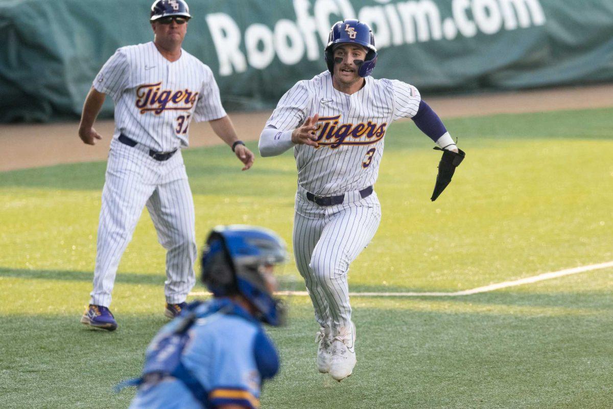 LSU baseball junior outfielder Dylan Crews (3) rushes to home base Tuesday, May 16, 2023, during LSU&#8217;s 7-4 win against McNeese State University at Alex Box Stadium in Baton Rouge, La.