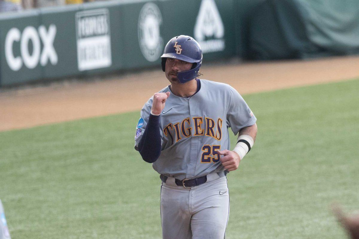 LSU baseball redshirt junior catcher Hayden Travinski (25) celebrates after scoring Sunday, June 11, 2023, during LSU&#8217;s 8-3 win against Kentucky at Alex Box Stadium in Baton Rouge, La.