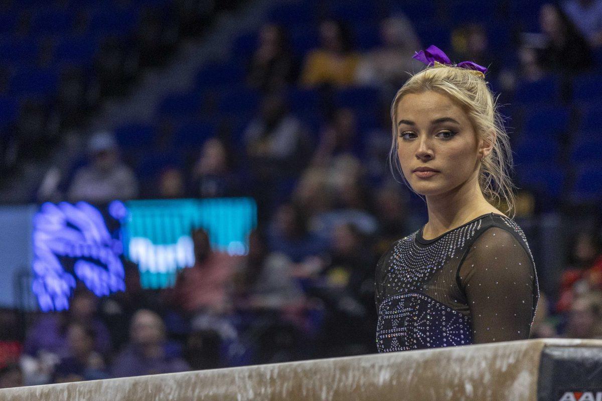 <p>LSU gymnastics senior all-around Olivia Dunne prepares for her balance beam routine Saturday, Dec. 16, 2023, during the annual Gymnastics 101 Exhibition in the Pete Maravich Assembly Center on LSU's campus.</p>