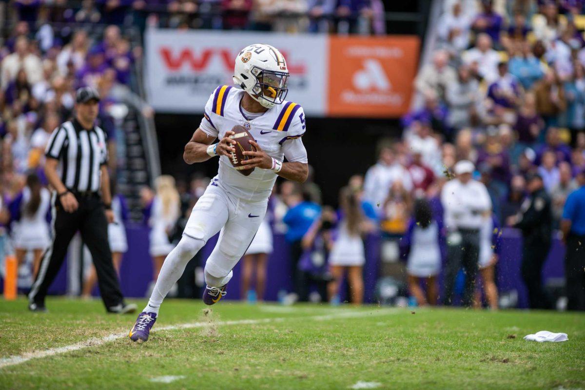 LSU football senior quarterback Jayden Daniels (5) runs the ball during LSU's 42-30 win against Texas A&amp;M on Saturday, Nov. 25, 2023, at Tiger Stadium in Baton Rouge, La.