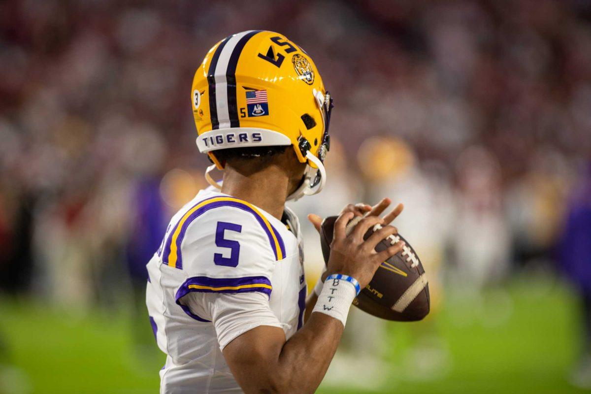 LSU football senior quarterback Jayden Daniels (5) prepares to throw the ball while warming up on Saturday, Nov. 4, 2023, before LSU's 42-28 loss against Alabama in Bryant-Denny stadium in Tuscaloosa, Al.