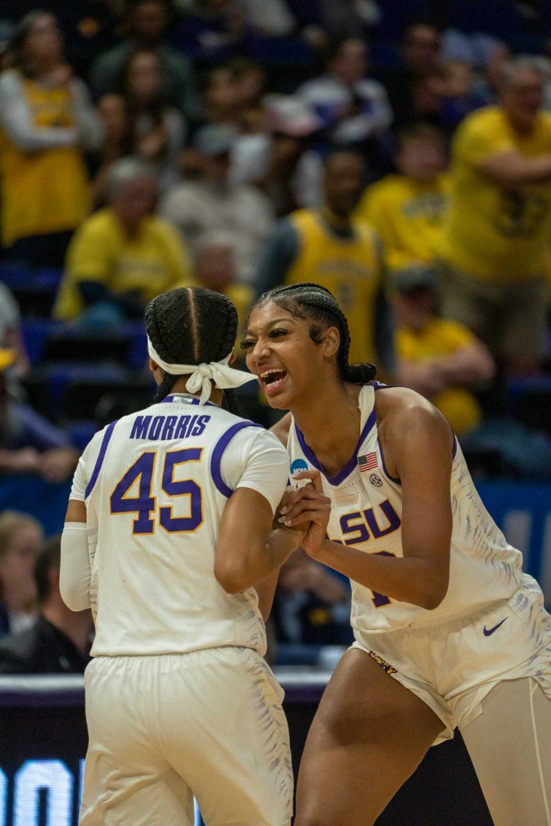 LSU women's basketball sophomore forward Angel Reese (10) cheers with 5th-year senior guard Alexis Morris (45) Sunday, March 19, 2023, during their 66-42 win against Michigan in the second round of March Madness at the Pete Maravich Assembly Center in Baton Rouge, La.