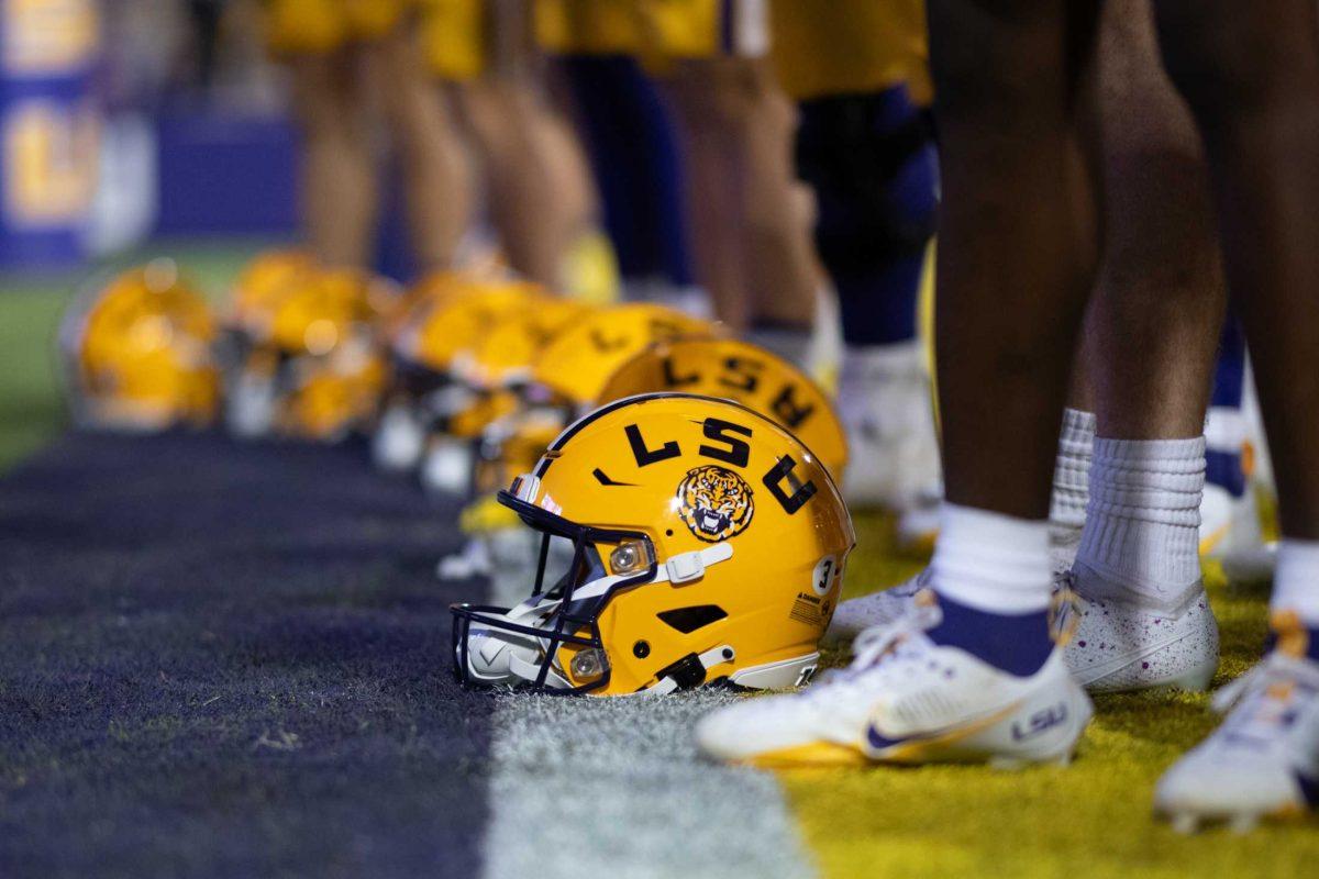 Football helmets rest on the field Saturday, Nov. 11, 2023, after LSU&#8217;s 52-35 win against Florida at Tiger Stadium in Baton Rouge, La.