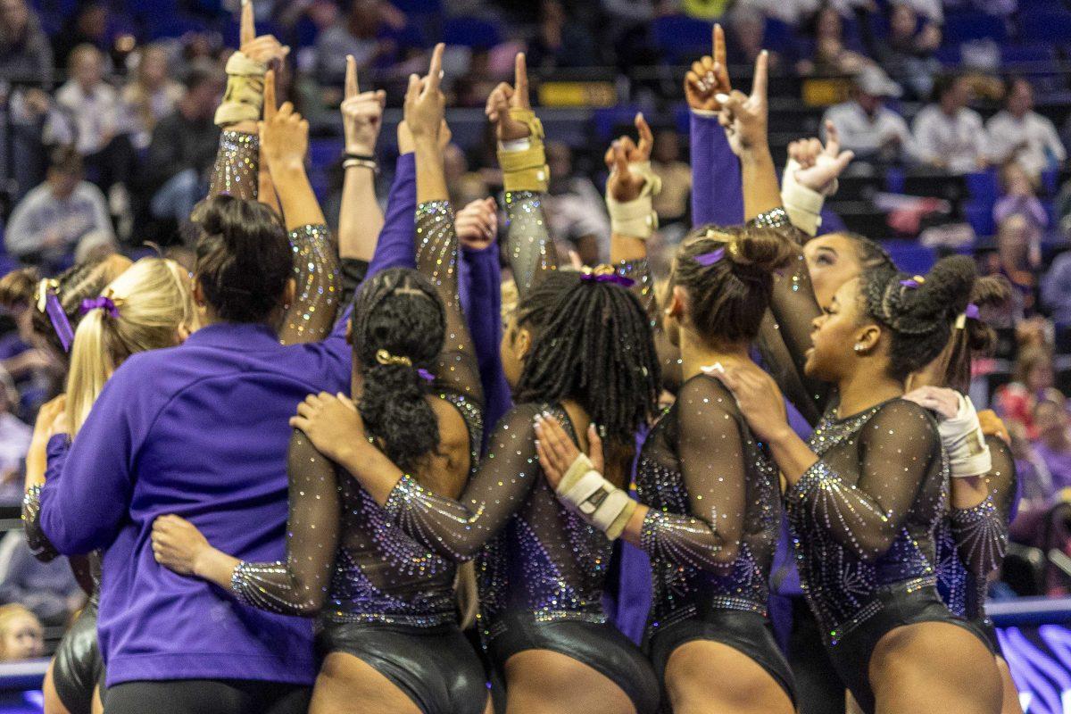 The LSU gymnastics team gives a cheer Saturday, Dec. 16, 2023, during the annual Gymnastics 101 Exhibition in the Pete Maravich Assembly Center on LSU's campus.