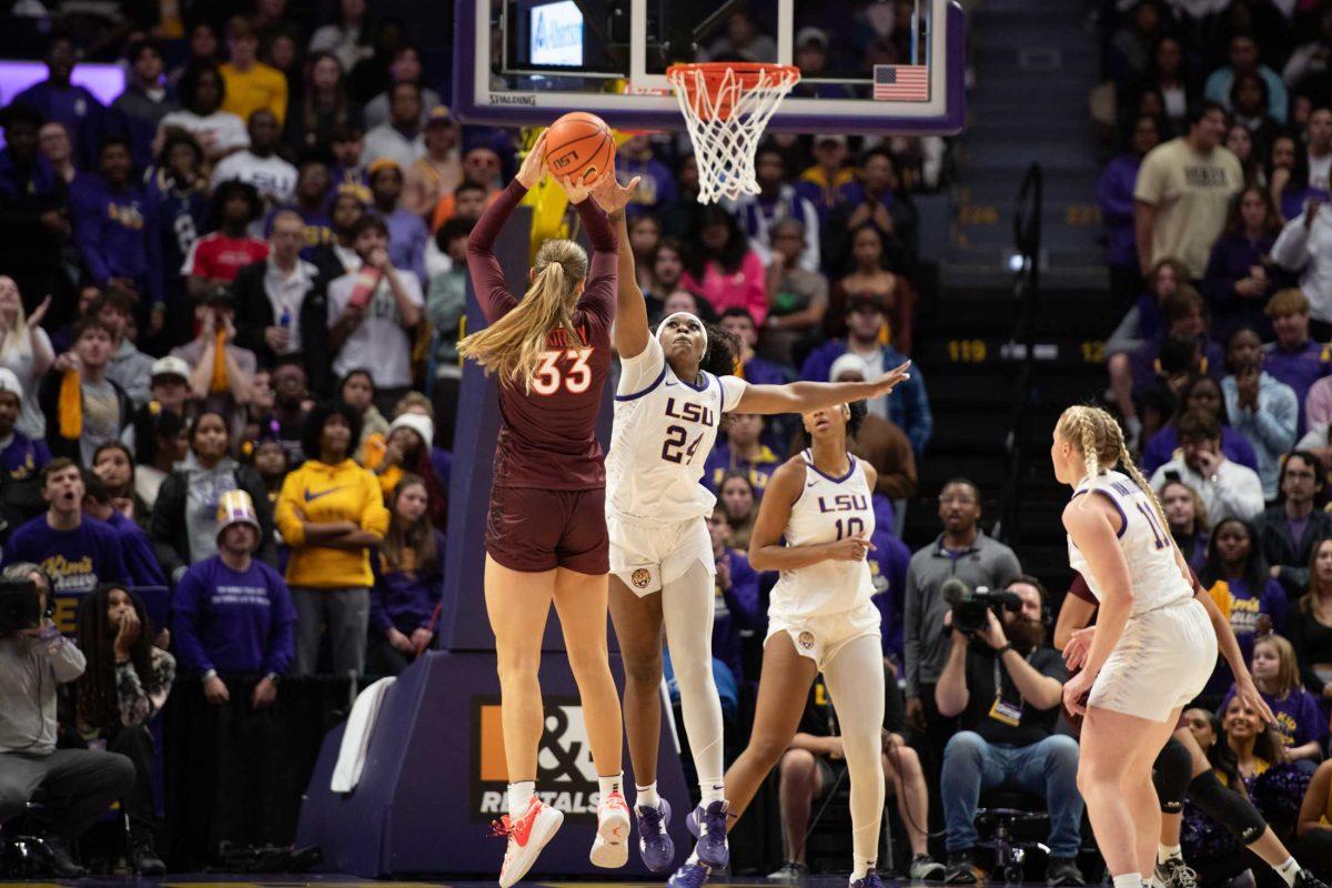 LSU women's basketball junior guard Aneesah Morrow (24) jumps to block a shot Thursday, Nov. 30, 2023, during LSU's 82-64 win against Virginia Tech at the Pete Maravich Assembly Center in Baton Rouge, La.