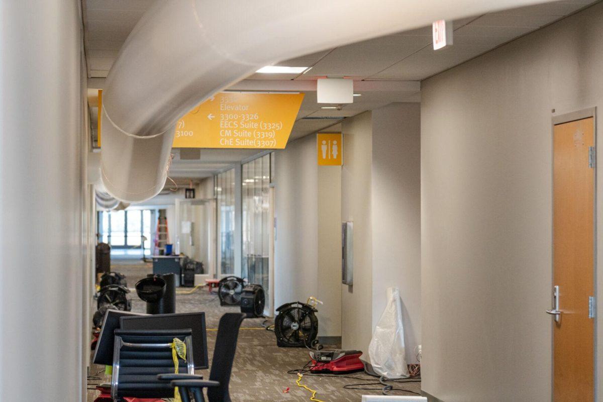 Fans line a hallway Friday, Jan. 19, 2024, inside Patrick F. Taylor Hall on LSU's campus in Baton Rouge, La.